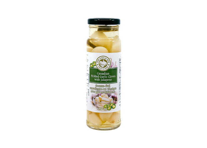 Canadian Pickled Garlic cloves with jalapeno — crisp, punchy and ready to eat. Add to salads, sandwiches, pasta or grazing boards.