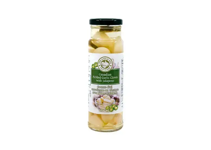 Canadian Pickled Garlic cloves with jalapeno — crisp, punchy and ready to eat. Add to salads, sandwiches, pasta or grazing boards.